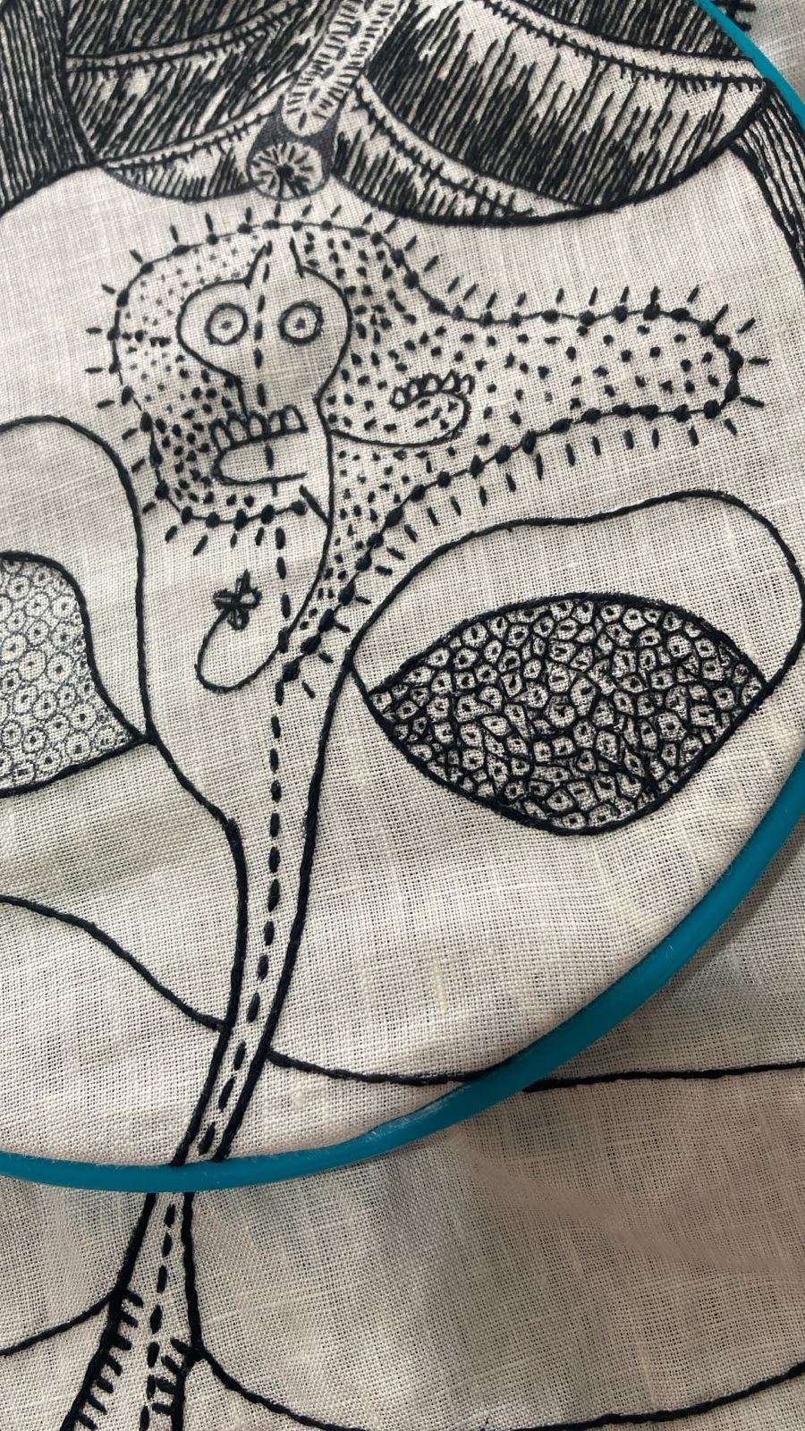 Close detail of a small figure motif with dotted texture